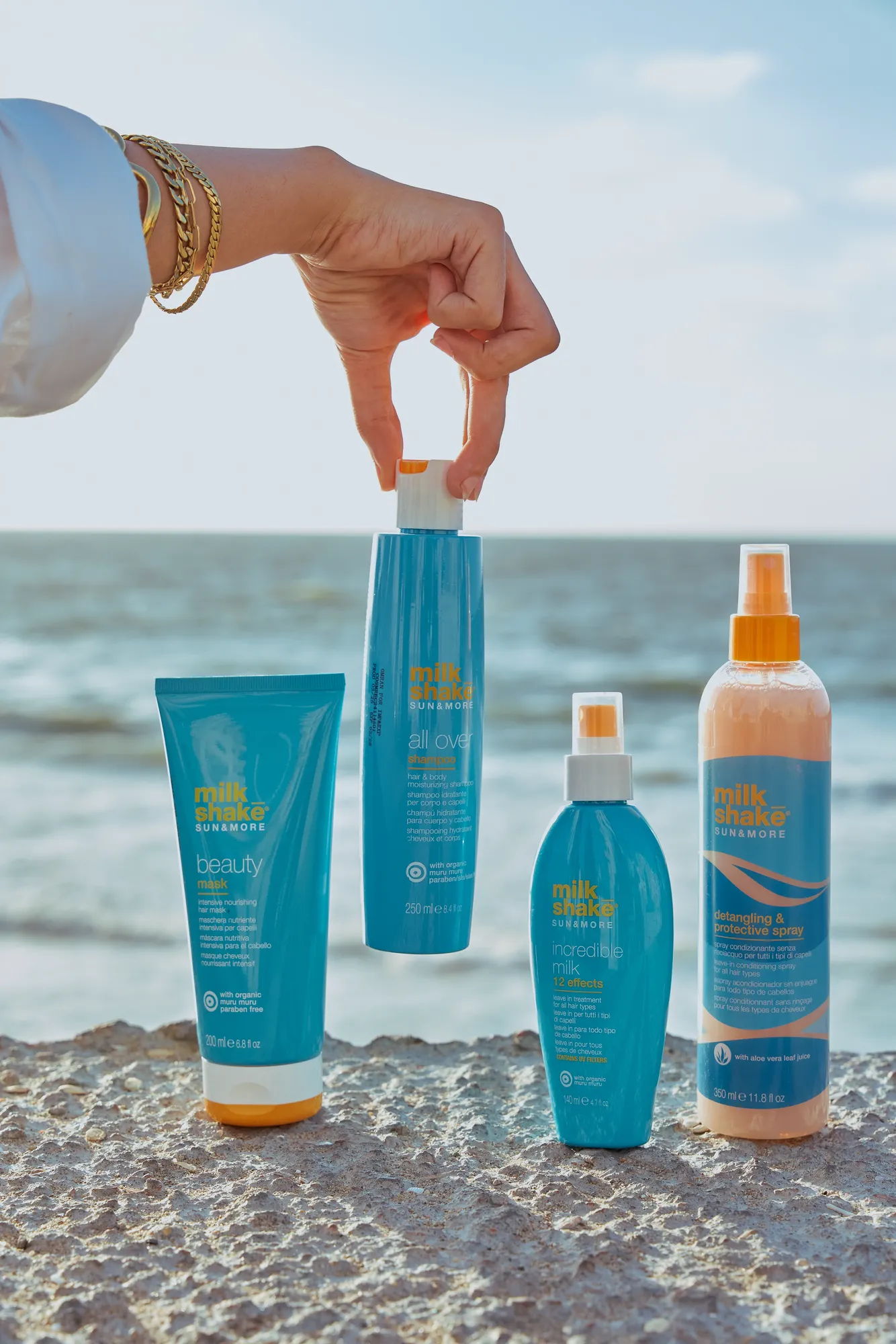 Capello products lined up on the sand