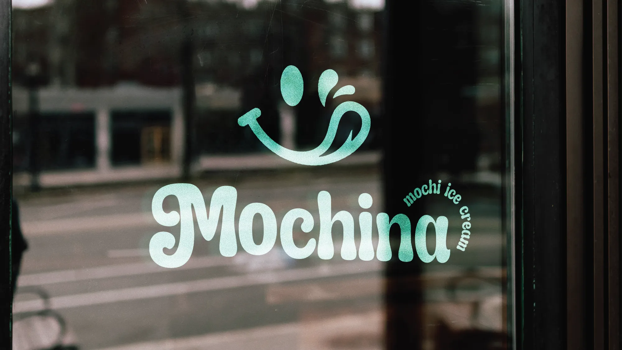 The Mochina logo on a shop window