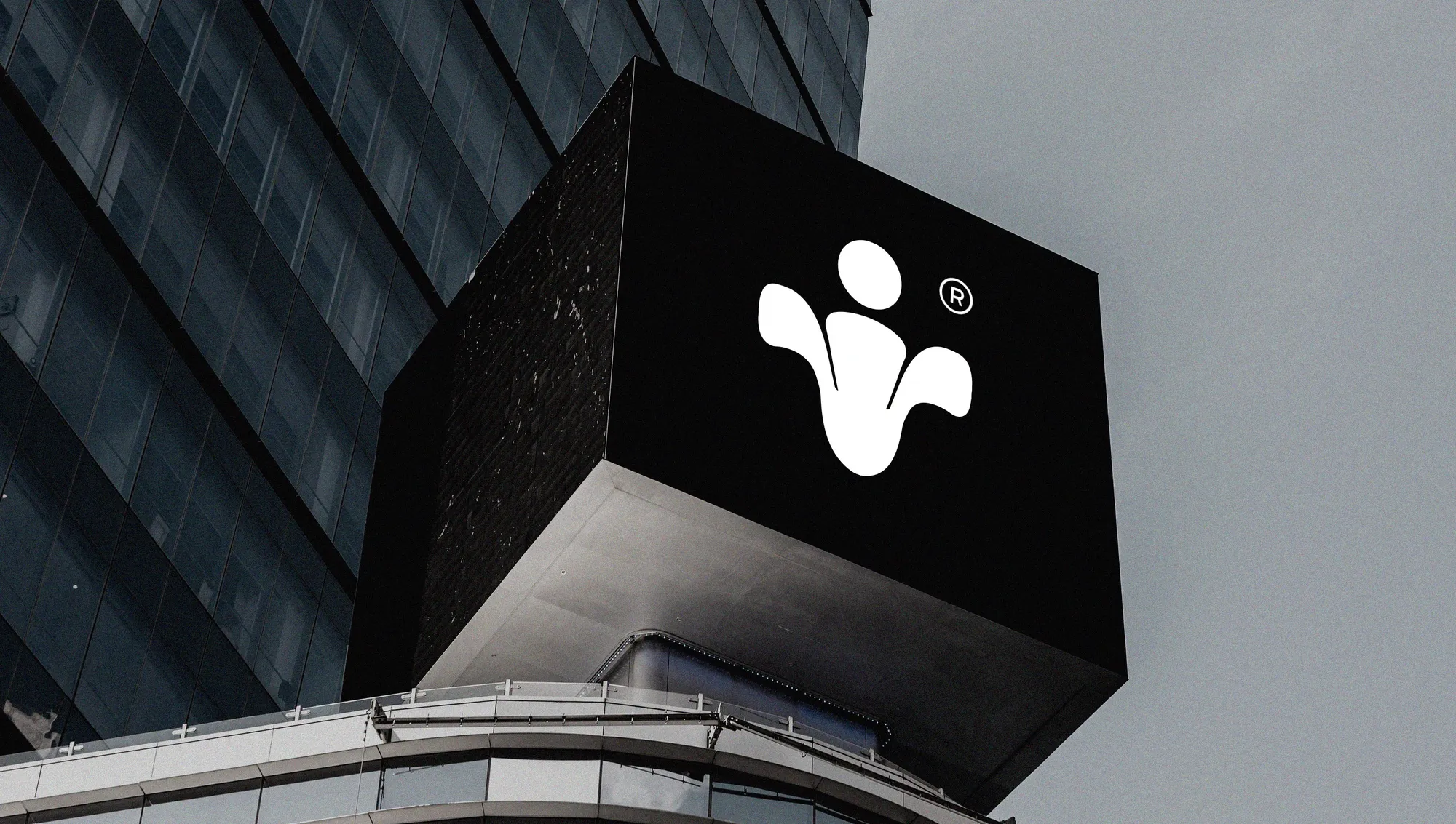 The Raanh mark on a black sign on a building